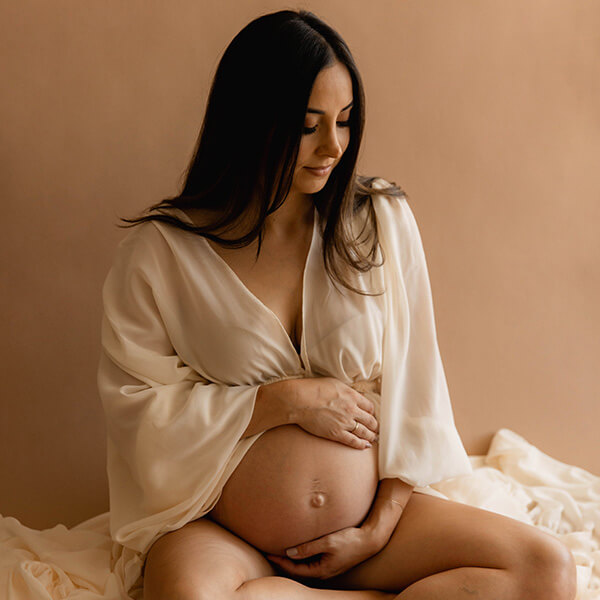 Expecting mum sitting on floor | Maternity Photography Sydney | Baby Photography Sydney
